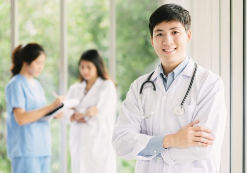 asian-male-doctor-front-medical-staffs